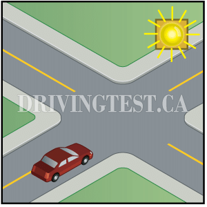 manitoba car - What is indicated by a flashing yellow beacon over an intersection?