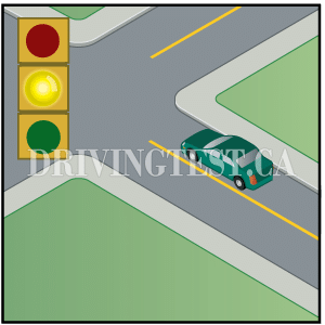 prince-edward-island car - What should you do if you're driving up to an intersection and a green light turns yellow?