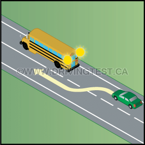 If a school bus has flashing yellow lights, what should you do? - If a school bus has flashing yellow lights, what should you do?